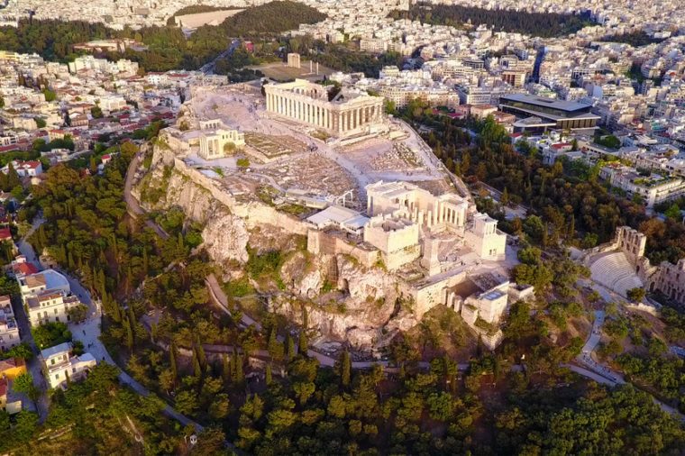 Aerial birds eye view photo taken by drone of iconic Acropolis hill and the Parthenon, Athens historic center, Attica, Greece