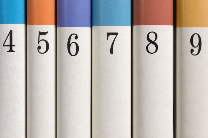 Six colored numbered books in a row