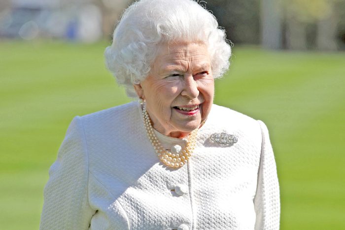 Queen Elizabeth II during the unveiling of a panel marking the walkway in Buckingham Palace gardens, London, in relation to the Commonwealth Walkway project.
