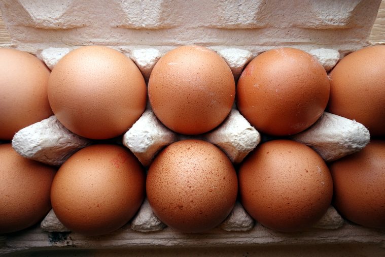 Organic eggs in a box, overhead view