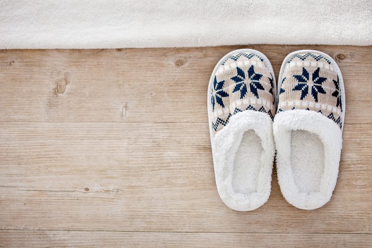 Slippers on wooden floor.Soft comfortable home slipper