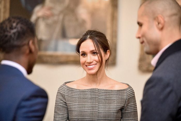 Meghan Markle chats with people inside the Drawing Room during a visit to Cardiff Castle.