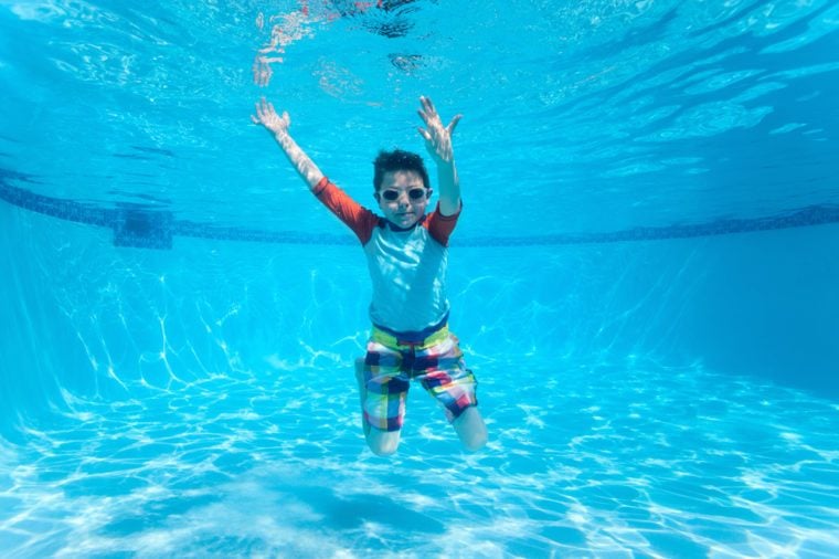 Cute boy underwater in swimming pool