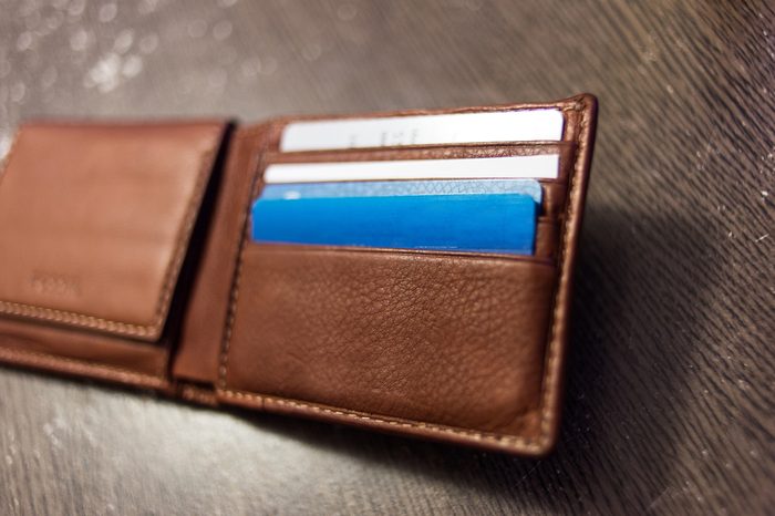 Credit cards in wallet on wood table