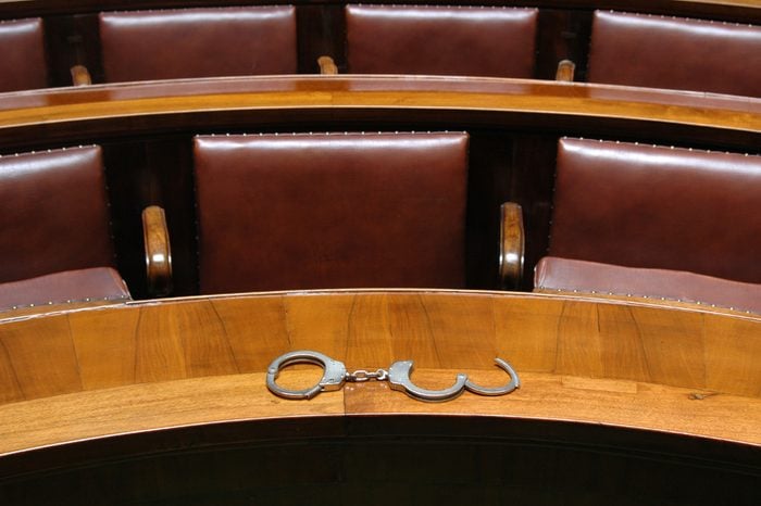 Interior in the empty courtroom with handcuff, law and justice concept