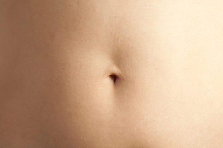Closeup - navel of the stomach of woman