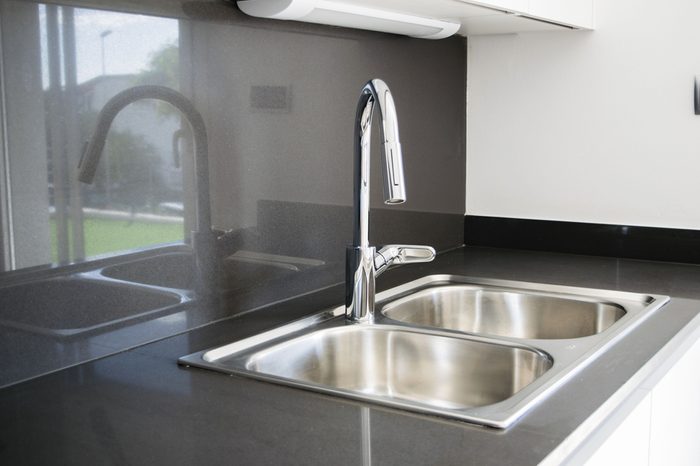 A double bowl stainless steel kitchen sink in a modern style