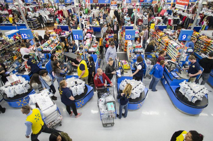 Customers leave happy from a Walmart store in Bentonville, AR, with their Black Friday items on . This year, Walmart stocked its digital and physical aisles with more than 1.5 million televisions, nearly two million tablets and computers and three million video games