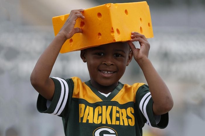 A fan wears a cheesehead before a preseason NFL football game between the Green Bay Packers and the Philadelphia Eagles, in Green Bay, Wis