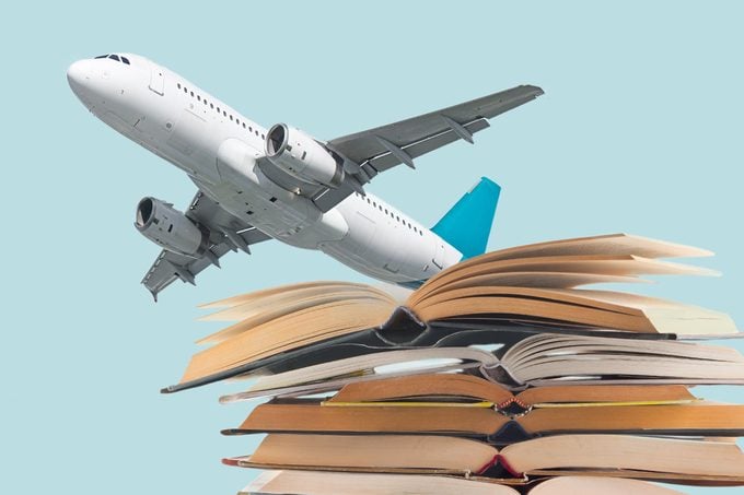 airplane taking off from books