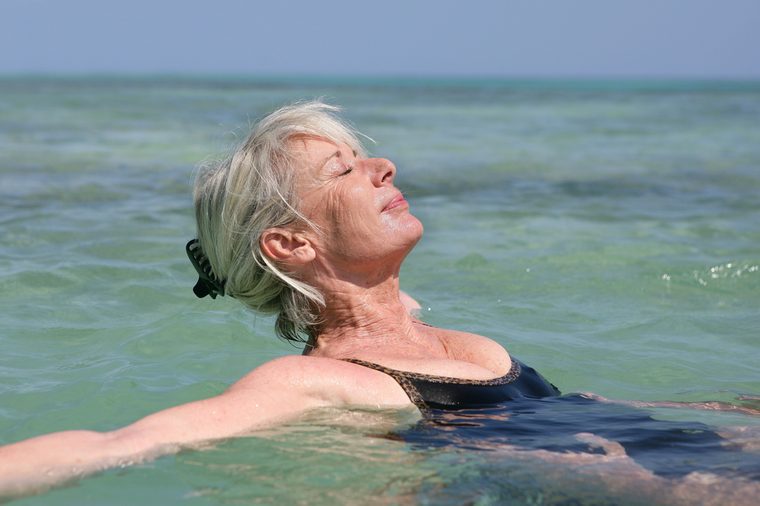 Portrait of a senior woman bathing in the sea