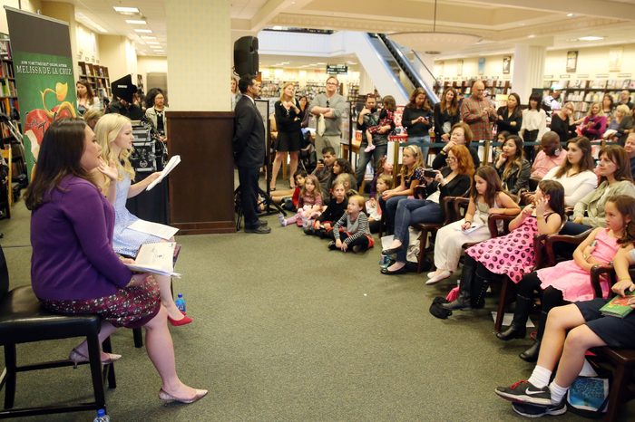 Author Melissa de la Cruz, left, and Dove Cameron, star of the Disney Channel original series "Liv and Maddie" and Disney's "Descendants", are seen at the book launch event for "The Isle of the Lost: A Descendants Novel" at Barnes & Noble, on in Los Angeles