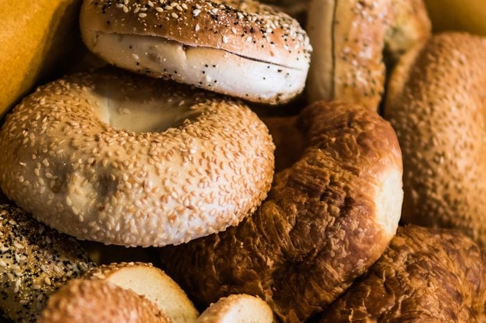 Close up of assorted bagels and croissants.
