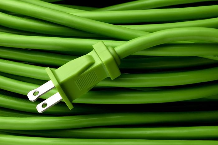 Close up shot of bright green electric extension cord