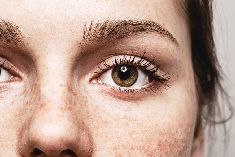 Eyes nose woman Young beautiful freckles woman face portrait with healthy skin