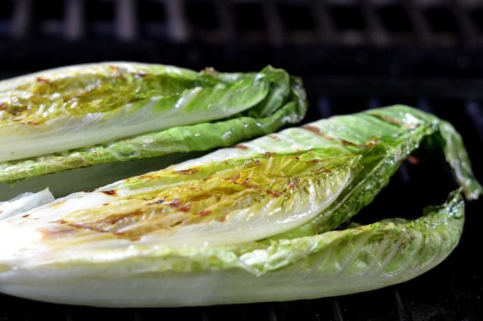Grilled Romaine Lettuce Halves on the Barbecue.
