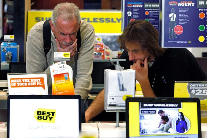 Michael O'Neil, Ara Gregorian Customer Michael O'Neil, left, is assisted by Best Buy sales associate, Ara Gregorian, as he shops for a laptop computer at Best Buy store in Glendale, Calif., . Shoppers shrugged off higher gas prices and cool temperatures to give retailers a surprisingly strong March