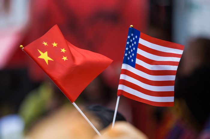 Chinese and American flags together outside