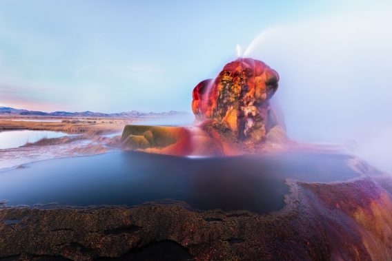 Fly Geyser near the Black Rock Desert in Nevada constantly erupts minerals and hot water creating bright colors and terraced pools.