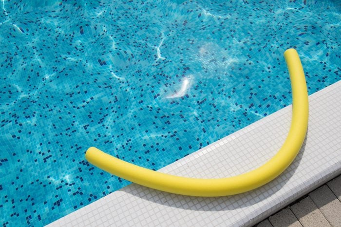 Yellow noodle in the swimming pool outdoor