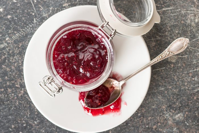 Raspberry jam jelly in jar. Top view.