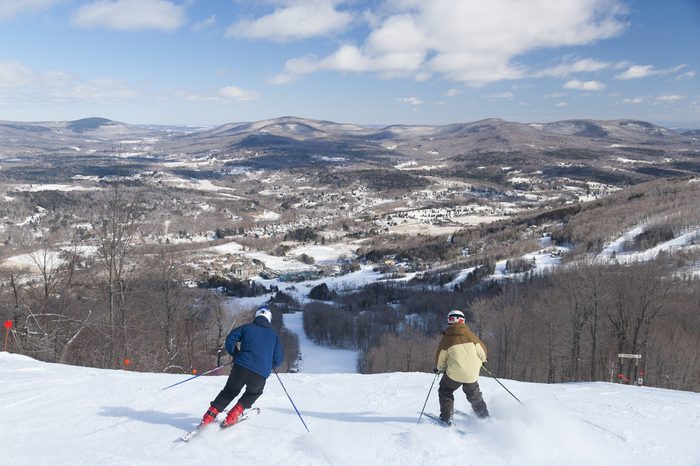 Overlooking the valley with skiers going downhill, Windham, New York, USA
