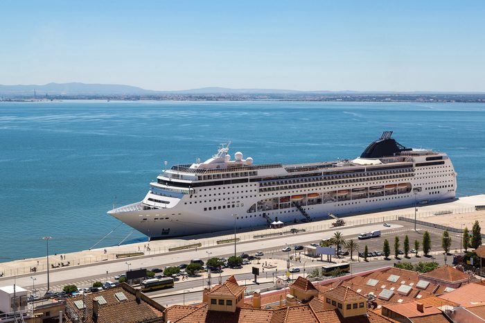 Big cruise ship is docked in Lisbon, Portugal in a beautiful summer day