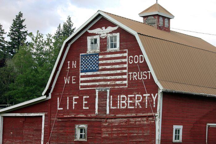 Patriotic Red Barn with Painted American Flag and "In God We Trust"