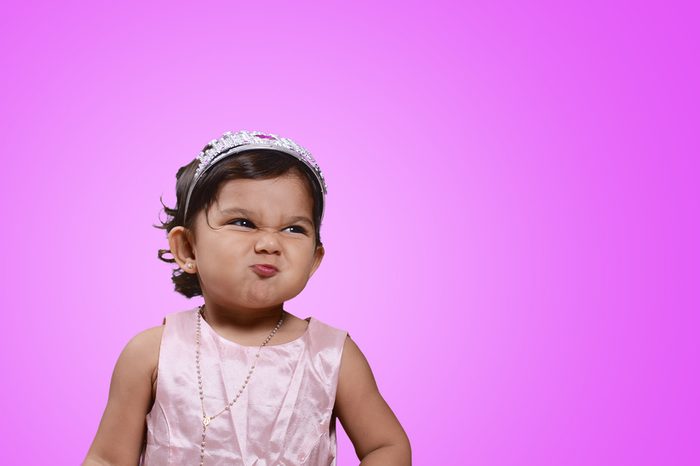 Beautiful baby on violet background