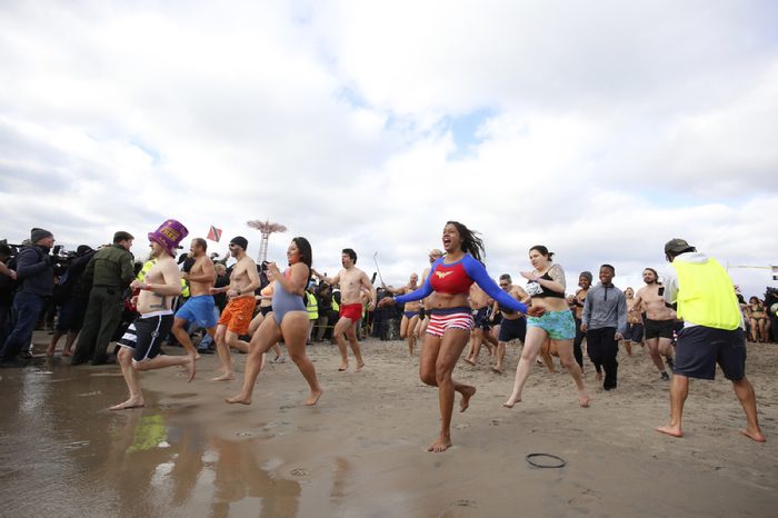 NEW YORK CITY - JANUARY 1 2016: Several hundred hardy New Yorkers plunged into the Atlantic waters off Coney Island in a tradition dating back to 1903.