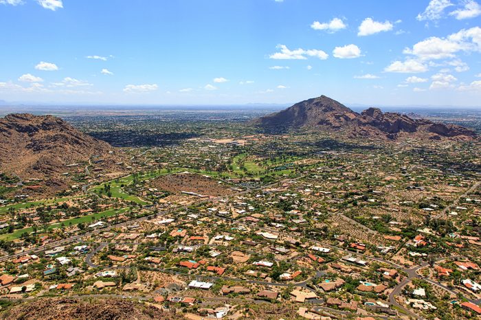 Aerial view of Paradise Valley and Camelback Mountain under Arizona's desert skies