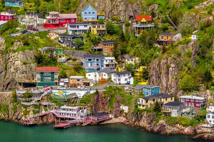Aerial view of beautiful colorful houses built on the rocky slope of the Signal Hill in St. John's Newfoundland, Canada