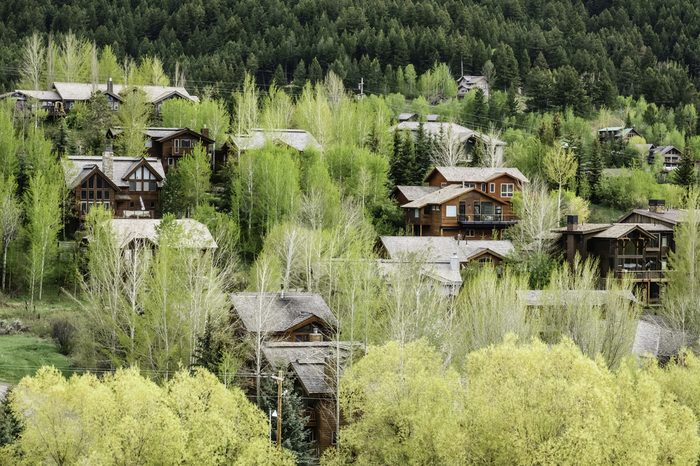 Upscale residential neighborhood in valley near base of mountain in Jackson, Wyoming, USA, in springtime