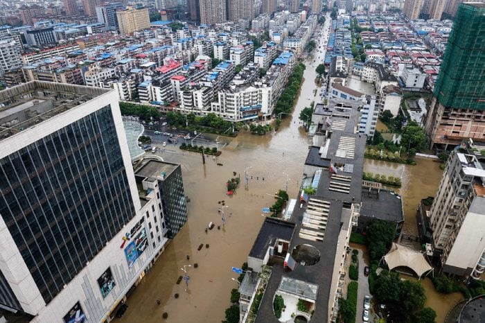 JIANGXI CHINA-July 1, 2017:Eastern China, Jiujiang was hit by heavy rain, and many urban areas were flooded. The vehicles were flooded, and the citizens risked their passage on flooded roads.