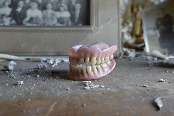 An old womans dentures found on a dresser in an old abandoned house