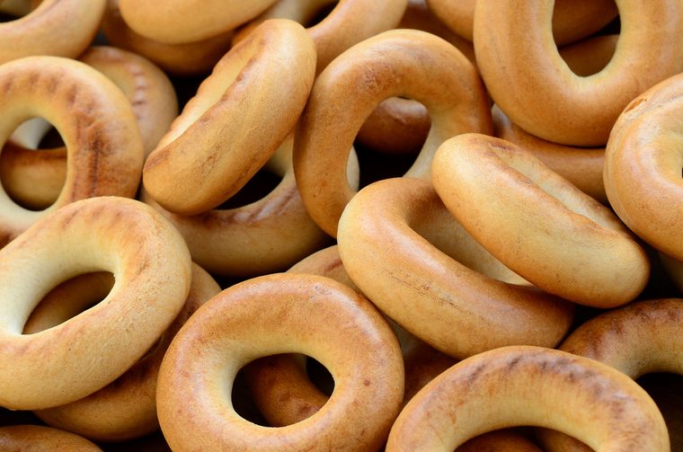 Close-up photo of fresh yellow bagels. A popular kind of flour products. One of the traditional Russian treats for tea