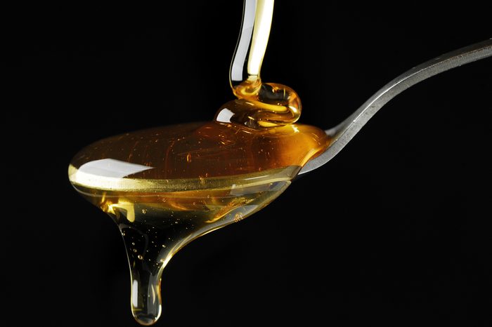 Pouring Maple Syrup over a Spoon
