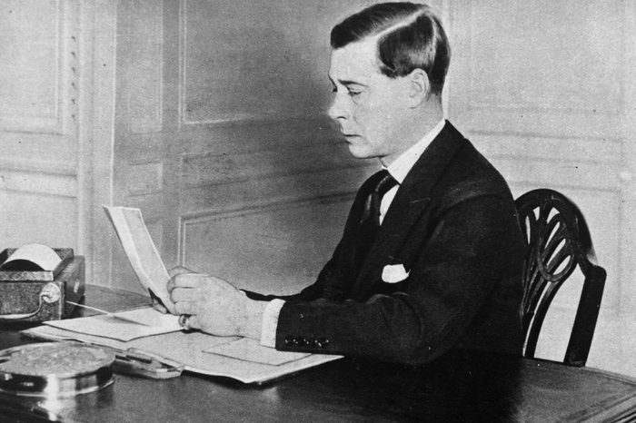 The Prince of Wales, later King Edward VIII studies papers at his office at St James's Palace, London.
