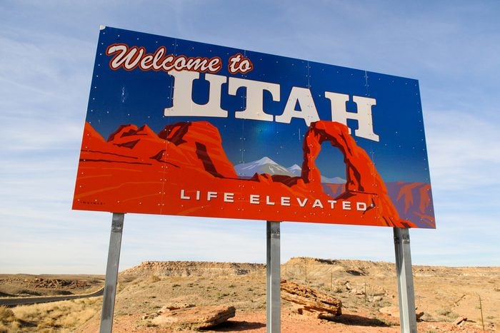 Welcome to Utah sign on a desolate desert highway