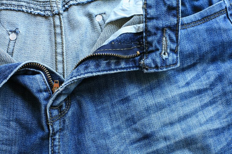Textured pattern: unzipped men blue jeans