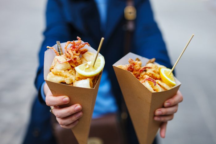 Italian street food grilled seafood fish, shrimps, calamari and vegetables