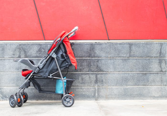 empty red baby Stroller