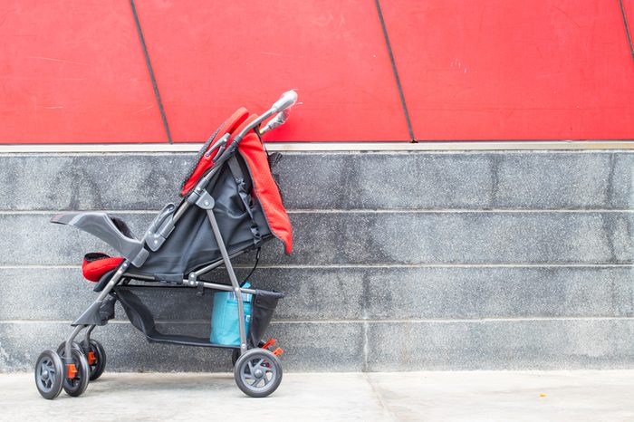 empty red baby Stroller
