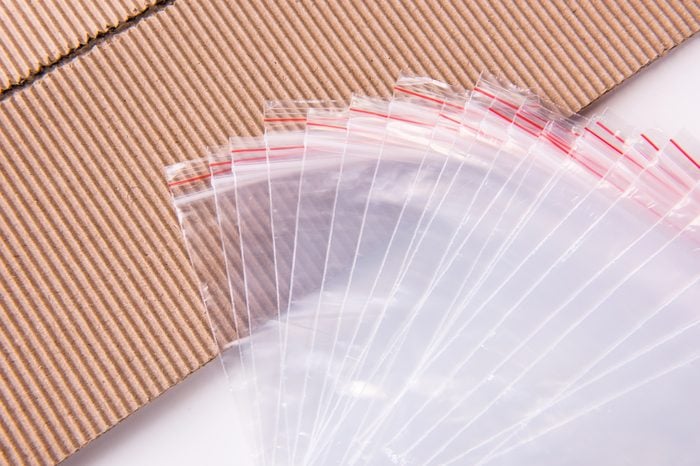 Sealing plastic bag and paperboard.