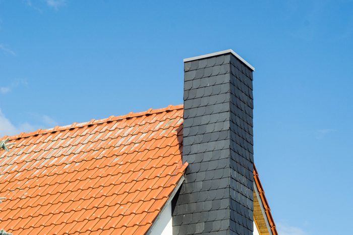 roof and chimney of a house at a sunny day