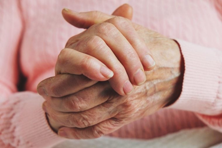 Very old senior woman hands wrinkled skin.