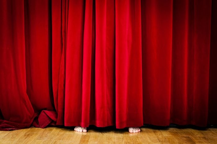 Hiding behind Red Curtain