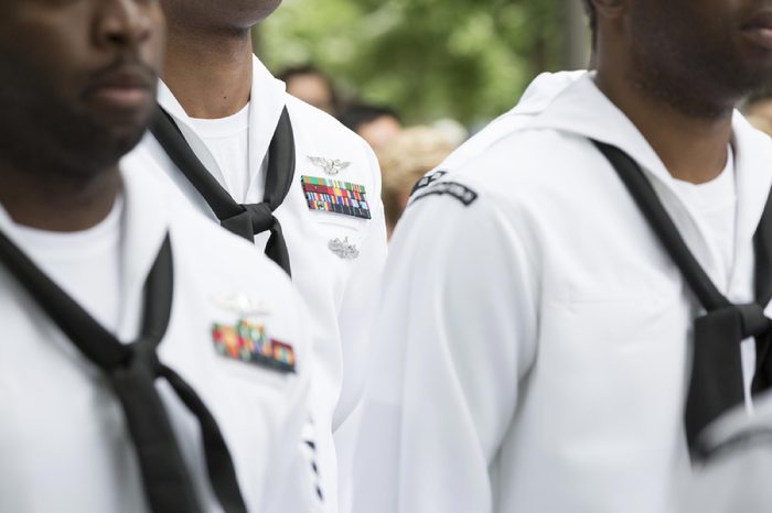 Close up of military medals, ribbons, and neck scarves worn by U.S. Navy personnel at the re-enlistment and promotion ceremony on National September 11 Memorial site. Fleet Week, NEW YORK MAY 26 2017