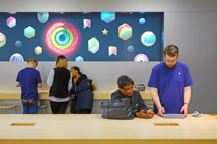 LAWRENCE, NJ -22 JAN 2018- View of customers coming to the Genius Bar in an Apple Store to get batteries replaced on their iPhones. Apple is facing delays in changing the batteries.