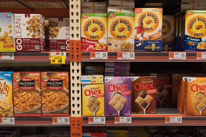 BOSTON, MASSACHUSETTS - MAY 22, 2017: Inside the Wegman's Grocery Store cereal aisle with various cereal brands on the shelves. Gluten Free options at the supermarket or grocery store.